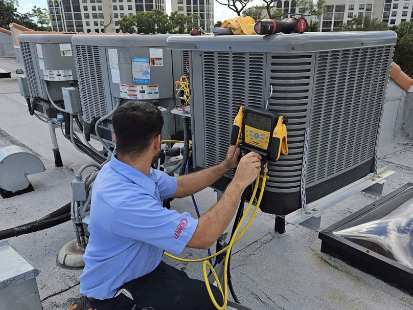AirSquad-Commercial-808×606 The Air Squad technician working on commercial AC unit
